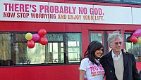 Dawkins posing in front of the God bus